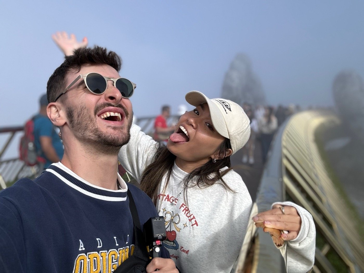 Oli and Vivi laughing together outdoors